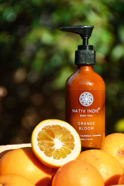 Orange Bloom Body Milk with Mandarin Orange and Calendula; organic skincare product with natural ingredients from the Himalayas for raw beauty.